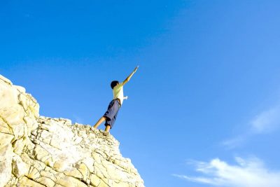 Boy on cliff