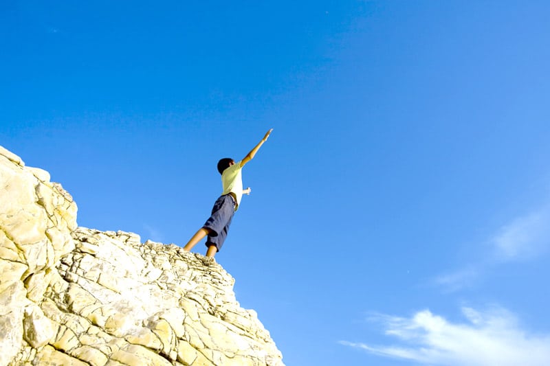 Boy on cliff