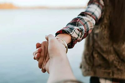 Couple holding hands