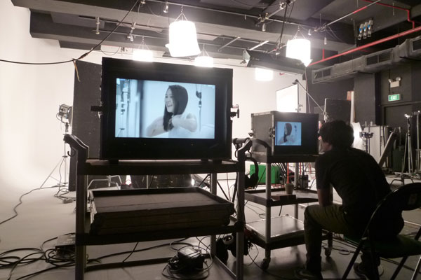 Dove Camera Confidence Shoot: Director Julius reviewing the takes