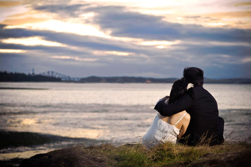 Engagement shoot: Watching the sun set together forever, till the end of time A sweet moment together (Cramond Beach)