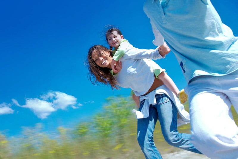 Family running on a field