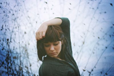 Girl with arm over head