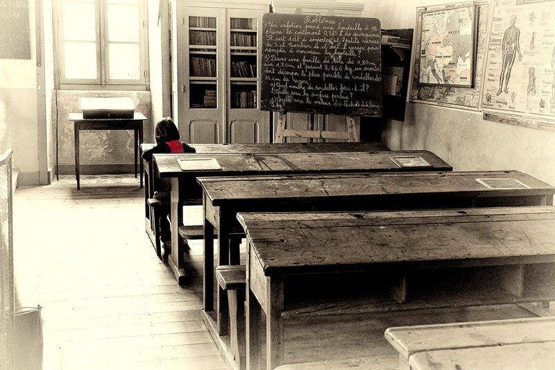 Girl alone in the classroom
