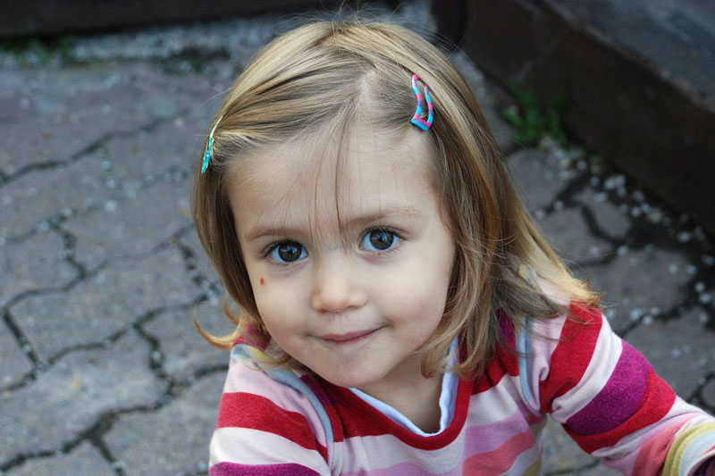 Little girl, hopeful look