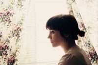 Sad girl at window