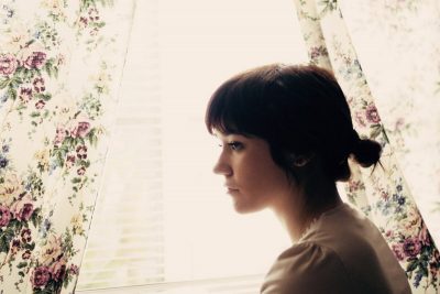 Sad girl at window