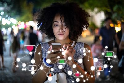 Girl using smartphone and looking at online comments