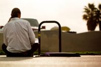 Back view of a guy, alone by himself