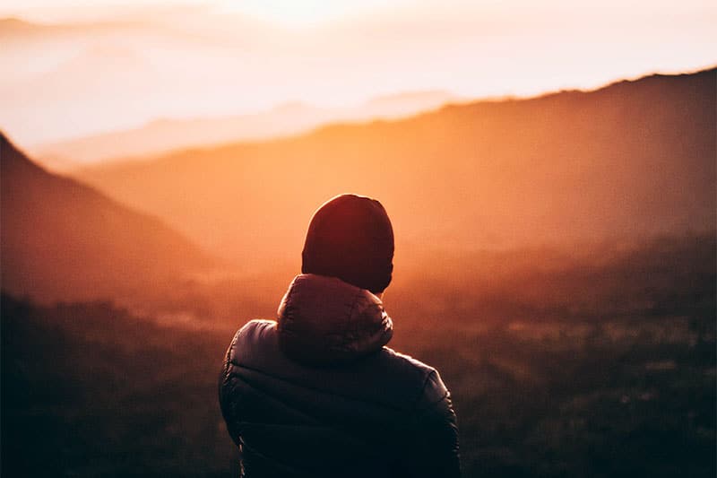 Back view of a guy on a mountain
