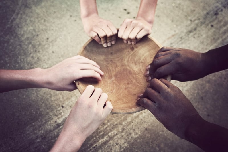 Hands grabbing empty bowl