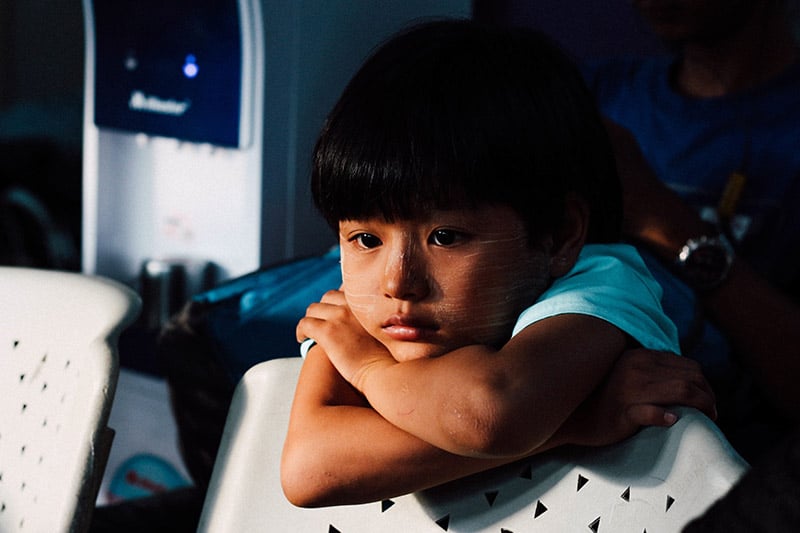 Little kid, alone in a dark room