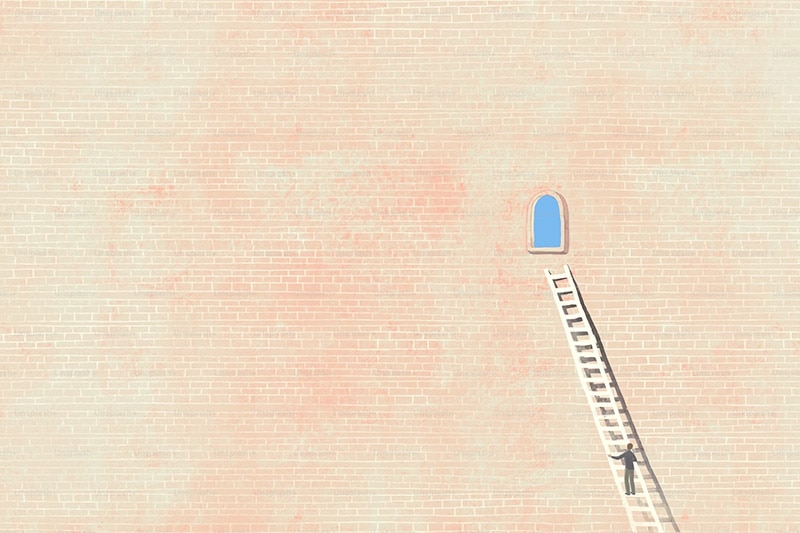 Man climbing ladder to the sky