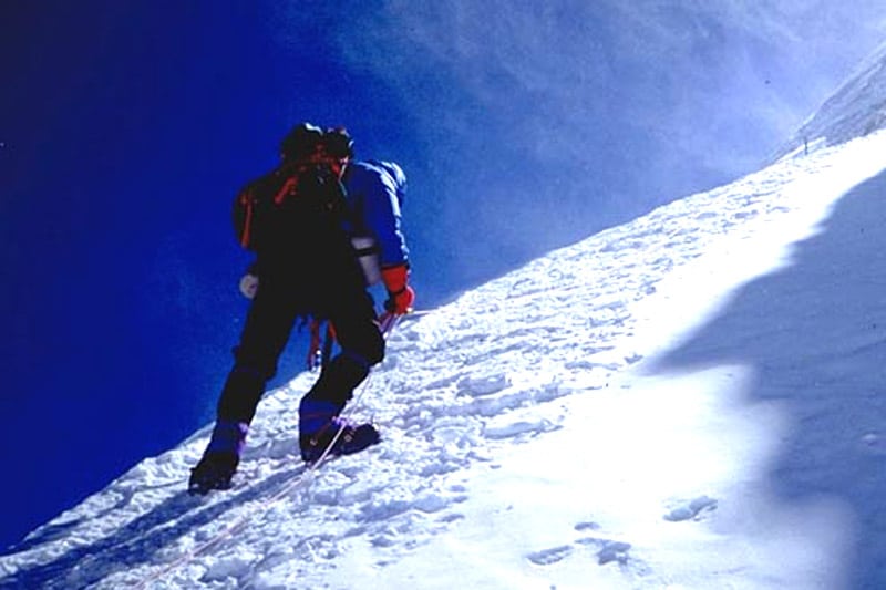 Man Climbing Mountain