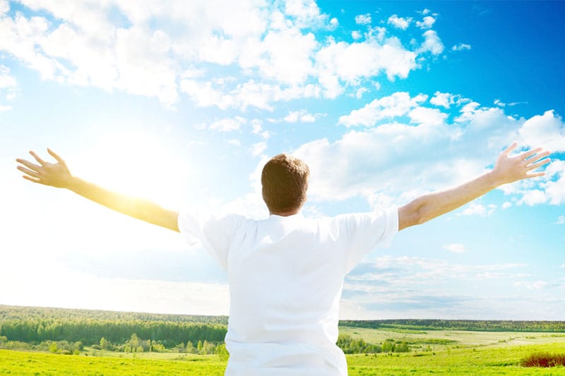 Man with arms outstretched