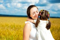 Mother and daughter hugging