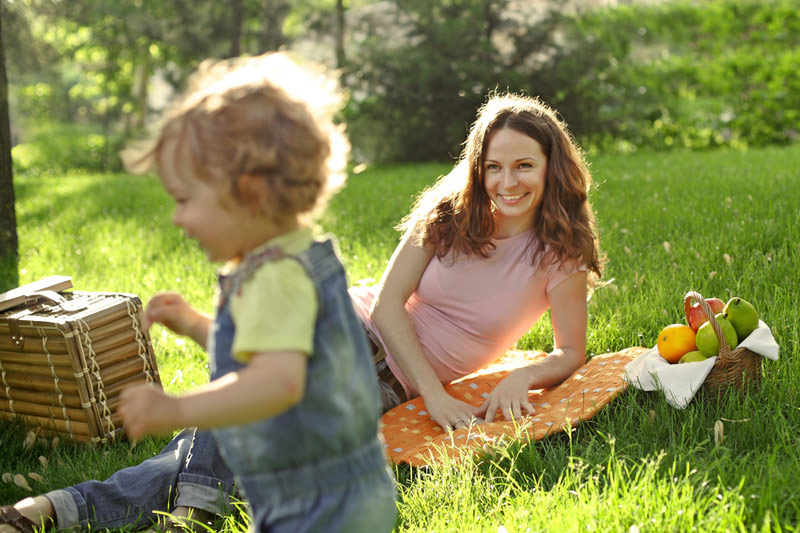Mother and daughter having a picnic