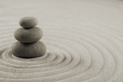 Pebbles stacked up on the sand