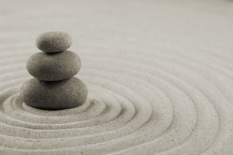 Pebbles stacked up on the sand