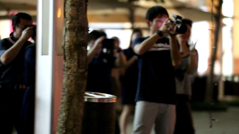 People taking photos and videos of us
