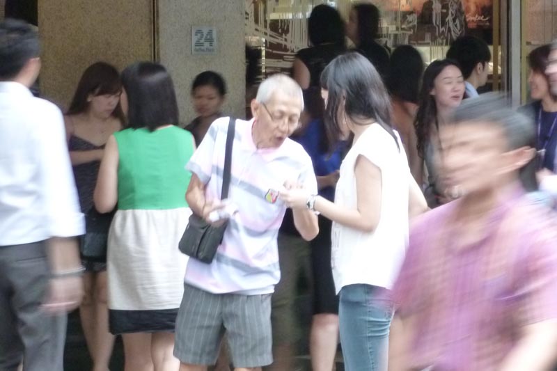 Celes hugging a senior citizen