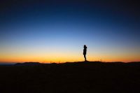 Silhouette of a person against sunset