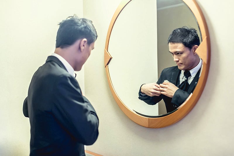 Ken looking into mirror