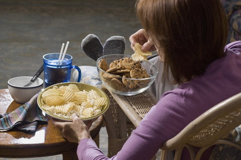 Woman bingeing, eating